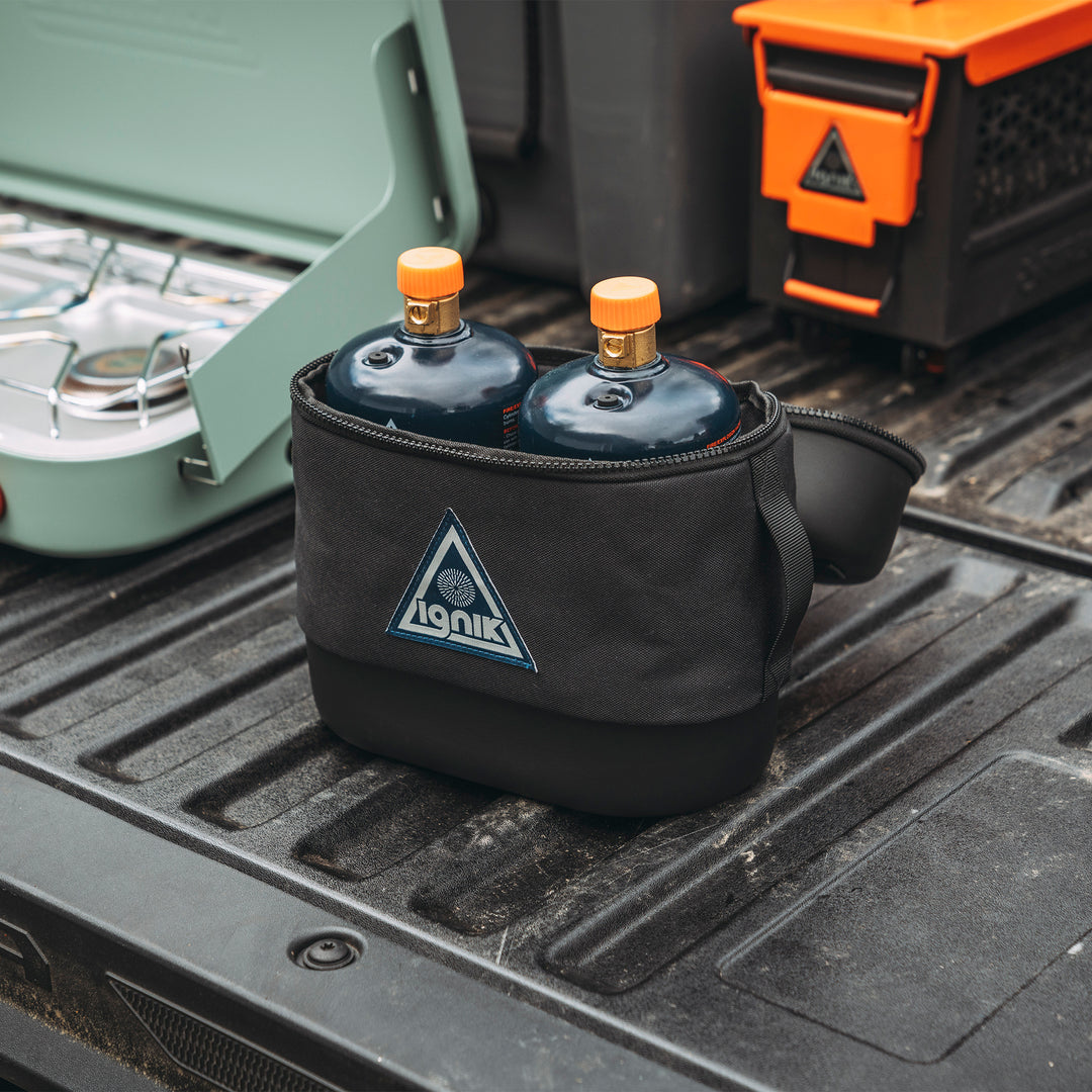 Black propane bottle case in back of truck open