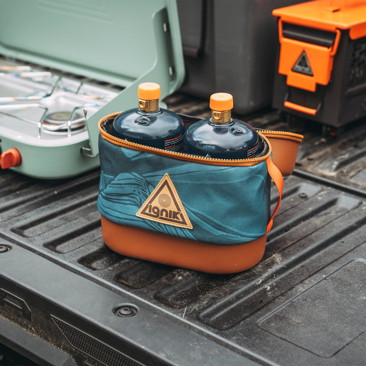 Mountain print propane bottle case in back of truck open